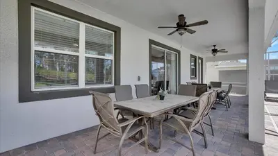 a dining room with a table and chairs at Parfect Paradise in Orlando