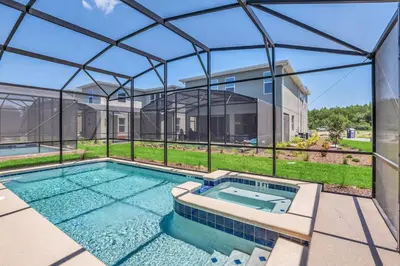 a swimming pool in front of a house at Winterfield storeylake 2759 in Kissimmee