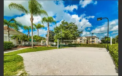 a basketball court in a park with palm trees at Apartment near Disney & UniversalEpic in Orlando