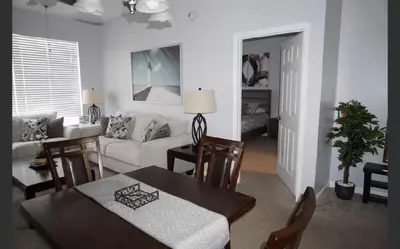 a living room with a couch and a table at Apartment near Disney & UniversalEpic in Orlando