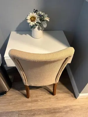 a white table with a chair and a vase with flowers at Condo 2 Queen beds-Disney-Universal in Orlando