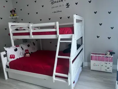 a bedroom with two bunk beds with red sheets at Amazing Condo near Disney in Kissimmee