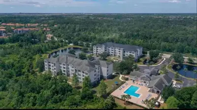an aerial view of a large house with a swimming pool at Amazing Condo near Disney in Kissimmee