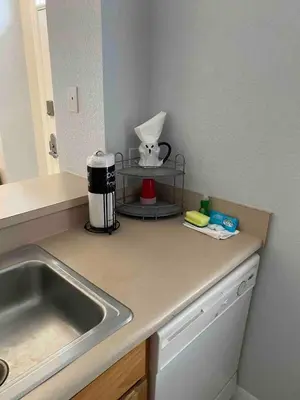 a kitchen with a sink and a counter top at Renovated 4 bed3 bath Townhome near Disney in Kissimmee