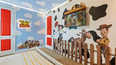 a room with a toy story mural on the wall at Upstay Spacious 5BR Villa Private Pool and Hot Tub in Orlando