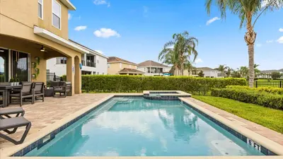 a swimming pool in the backyard of a house at Upstay Spacious 5BR Villa Private Pool and Hot Tub in Orlando