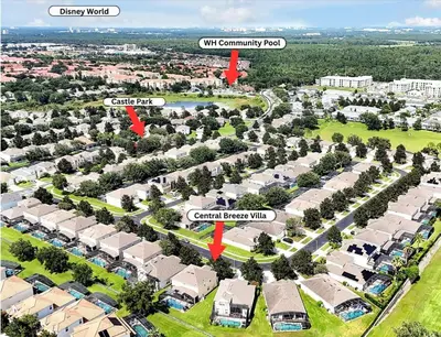 an aerial view of a community park with houses at 6 Bedroom Villa located in Windsor Hills 3 miles to Disney Free Heated Pool & Spa Game Room with PS5! in Orlando