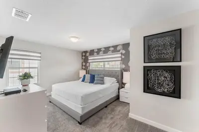 a white bedroom with a bed and a window at 4822 Resort Pool House Disney Universal Orlando in Kissimmee