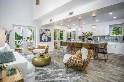 a large living room with a kitchen and a living room at 24-7 Vacation Club! Affordable Vacation Stays, Multiple Units Available, All Over Florida! Name your price today! in Kissimmee