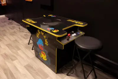 a game table with a stool next to a game console at Storey Lake Resort 515 - Hosted by Top Villas in Kissimmee