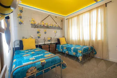 a bedroom with two beds and a yellow ceiling at Storey Lake Resort 515 - Hosted by Top Villas in Kissimmee
