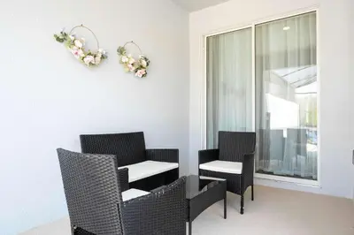 a room with three chairs and a table and a window at Last Minute Disney Private Pool Themed Bedrooms. Book Now SLR516 in Kissimmee