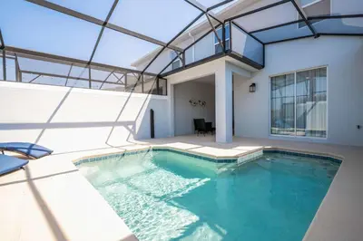 an indoor swimming pool with a glass ceiling at Last Minute Disney Private Pool Themed Bedrooms. Book Now SLR516 in Kissimmee