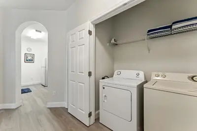 a laundry room with a washer and dryer at Last Minute Disney Luxury Condo with Balcony. Book Now WP77 in Orlando
