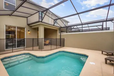a swimming pool in a house with a glass roof at Storey Lake Resort 510 - Hosted by Top Villas in Kissimmee