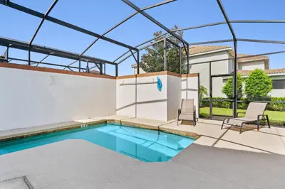 a swimming pool in a house with a glass ceiling at Storey Lake Resort 511 - Hosted by Top Villas in Kissimmee
