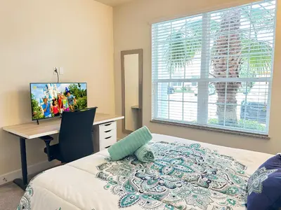 a bedroom with a bed and a desk with a computer at TR1435RC - 3BR - Sleeps 8 in Orlando