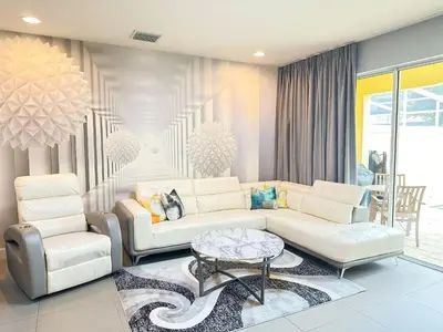 a living room with a couch and a table and chairs at TR1435RC - 3BR - Sleeps 8 in Orlando