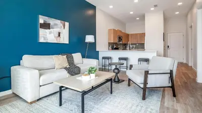 a living room with a couch and chairs and a table at Landing Incredible 1BD Gym Clubhouse in Orlando