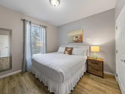 a bedroom with a bed and a window at Magnificent 2 Bedroom Apt Vista Cay Resort 107 in Orlando