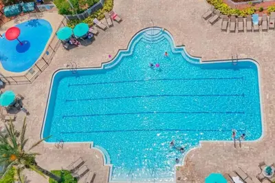 an overhead view of a swimming pool at a resort at Amazing 3BDR House with pool in Kissimmee