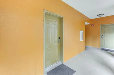 an empty hallway with two doors in a building at Poolside Bliss and Theme Park Thrills Orlando Oasis in Orlando