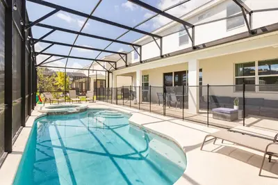 an indoor swimming pool with a glass roof at Sleeps 36 | 15 Bedroom! Theater! Resort! POOL! in Kissimmee