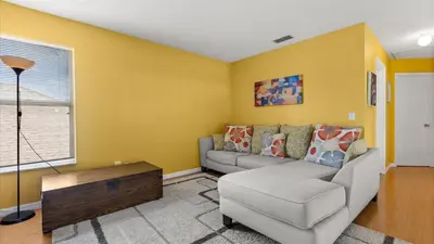 a living room with a couch and a table at Upstay 3BR Family-Friendly Stylish Retreat w Patio in Kissimmee