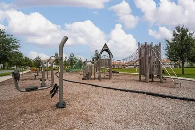 a park with a playground with a slide at Private Pool 4BR Home in Orlando in Kissimmee