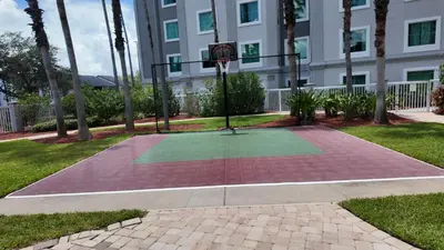 a basketball hoop in front of a building at 110 - Next to Disney - Pool in Orlando