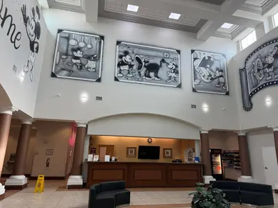 a lobby of a hospital with art on the walls at 110 - Next to Disney - Pool in Orlando