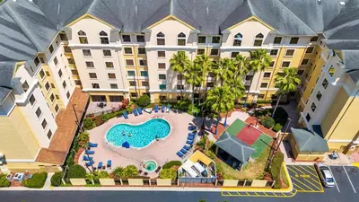 an aerial view of a resort with a swimming pool at Condo near Epic & Universal,free parking & Netflix in Orlando