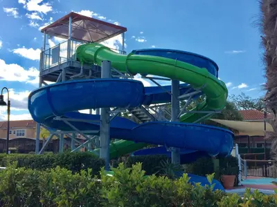 a water slide in a park with a tower at Waterfront ParadiseClose 2 DisneyGated Community in Orlando