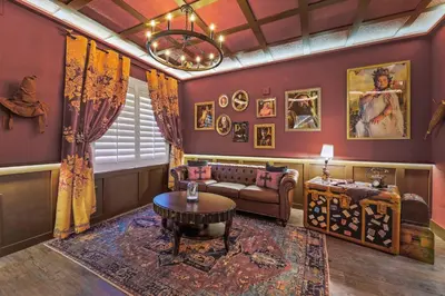 a living room with a couch and a table at Harry Potter Stay Near Universal in Orlando