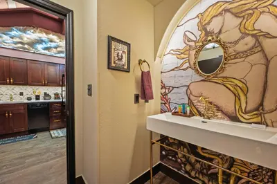 a bathroom with a sink and a mirror at Harry Potter Stay Near Universal in Orlando