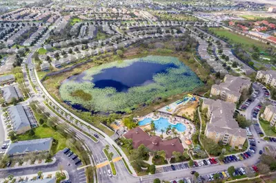 an aerial view of a lake in a city at Palm Tree Paradise 3 bedroom condo at Windsor Hills close to Disney in Orlando