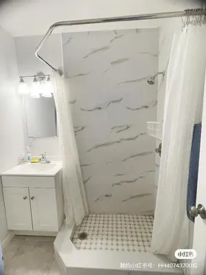 a bathroom with a shower and a sink at Happy Home in Orlando