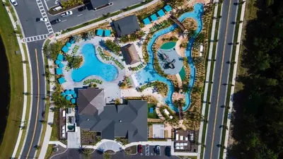 an overhead view of a pool at a resort at Family Stylish 4BR Pool Townhome Storey Lake in Kissimmee