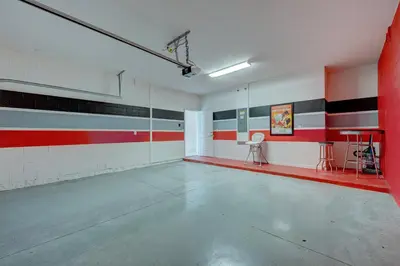 an empty gym with red white and black stripes on the walls at Bellavida Resort Retreat with Private Pool in Kissimmee
