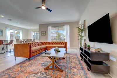 a living room with a couch and a tv at Bellavida Resort Retreat with Private Pool in Kissimmee