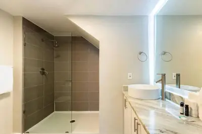 a bathroom with a shower and a sink at 3 Bedroom 2 Bathroom Villas At Seven Dwarfs 30-105 in Kissimmee