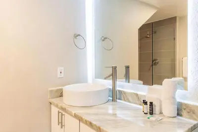 a white bathroom with a sink and a mirror at 3 Bedroom 2 Bathroom Villas At Seven Dwarfs 30-105 in Kissimmee