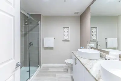 a bathroom with a sink toilet and a shower at 3 Bedroom 2 Bathroom Villas At Seven Dwarfs 30-105 in Kissimmee