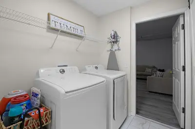 a white washer and dryer in a living room at Luxurious Family Resort Getaway in Kissimmee