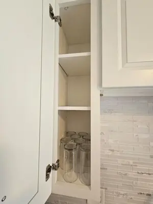 a kitchen pantry with glass jars in it at Magical Getaway- Cozy Home Minutes from Disney, Restaurants & Outlets! in Kissimmee