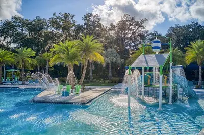 a water park with a water slide in a pool at The Venue Mansion in Kissimmee