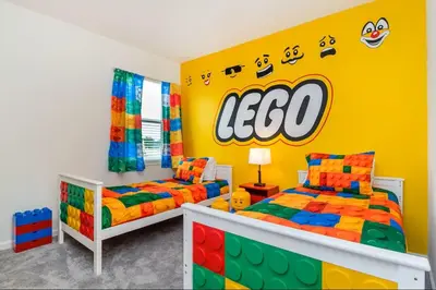 a room with two beds and a lego wall at The Venue Mansion in Kissimmee
