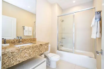 a bathroom with a shower sink and a toilet at Modern Magic Village Home for 12 with Grill 3131 in Orlando