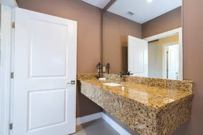 a bathroom with a large marble counter top at Modern Magic Village Home for 12 with Grill 3131 in Orlando