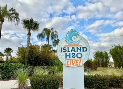 a sign for island in a park with palm trees at Waves of Relaxation - For 8 in Orlando